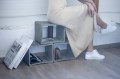 Concrete table used as a modern bookshelf.