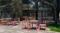Outdoor cafe with Nørrebro Outdoor Table 150 cm 4-6 Seats and matching chairs.