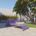 Purple Ørestad Lounge Bench in a modern outdoor setting with greenery and tiled walls.