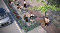 Potted plants arranged in Nordhavn Outdoor Planters | 130 l along a sidewalk seating area.