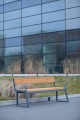 Amager 4 Seater Public Backrest Bench w/ Armrest in front of modern building.