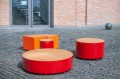 Valby Public Backless Bench | Round in a courtyard setting.