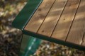 Nyboder Outdoor Table 150 cm with wooden top and green metal frame.