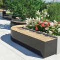 Valby Public Backless Bench | Rectangular in a garden setting with flowers and greenery.