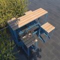 Frederiksberg Bar Set: Table &amp; 4 Bar Stools, outdoor setting with blue metal frames and wooden tops.