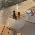 Kødbyen Outdoor Stool | 45 cm next to pool with pitcher and cups on top.