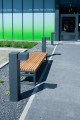 Hellerup 3 Seater Public Backless Bench in front of a modern building.
