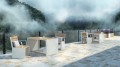 Moderne Indre By 1-Personen-Rückenlehnenbank mit Armlehne“ auf einer Terrasse mit Bergblick.