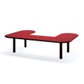 U-shaped Sydhavn Public Backless Bench in red with black legs.