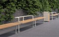 Holmen 3 Seater Public Backless Bench along a paved walkway with greenery background.