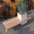 Banc Holmen avec Bac à Fleurs en bois et métal, avec un bac à fleurs intégré, entouré de plantes colorées.