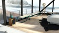 Banc public sans dossier Christiania 3 places dans un salon moderne avec vue sur la mer.