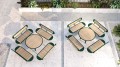 Ensemble Nordhavn : configuration de table ronde en bois avec quatre bancs sur un patio moderne.