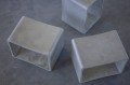 Concrete table modules on a grey surface.