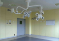 Operating room with specialized surgical lights and equipment.