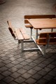 Square Bench &amp; Table set on a cobblestone pavement