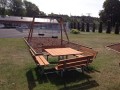 Square Bench &amp; Table set in a park near a playground swing set.