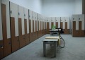 Lockers and benches in a changing room.
