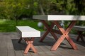 Outdoor Garden set with wooden X-legs and white tabletop.