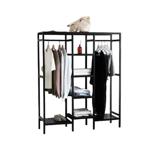 Black metal clothing rack with shelves and hanging rod displaying clothes and a bag.