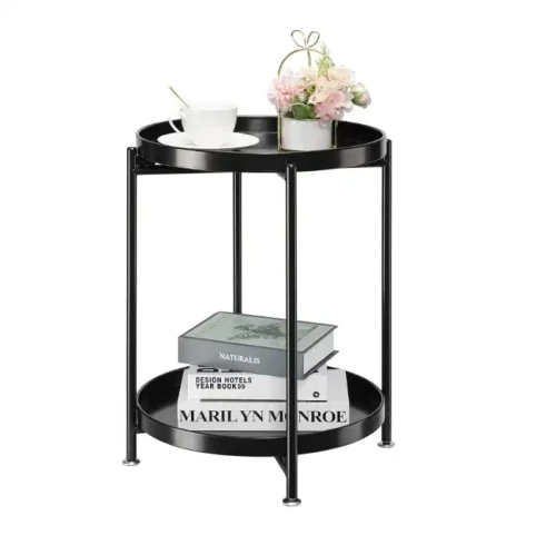 Round black 2 tiers coffee table with books, cup, and flowers
