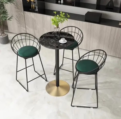 Wedding And Studio Decor Iron Chair With Cushion Multiple Color And Size set around a small black marble table with a plant centerpiece