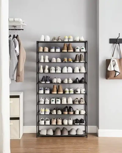 Compact and Convenient Modern Metal Material Shoes Rack Space Saver Tall Shoe Rack filled with shoes in a stylish room.