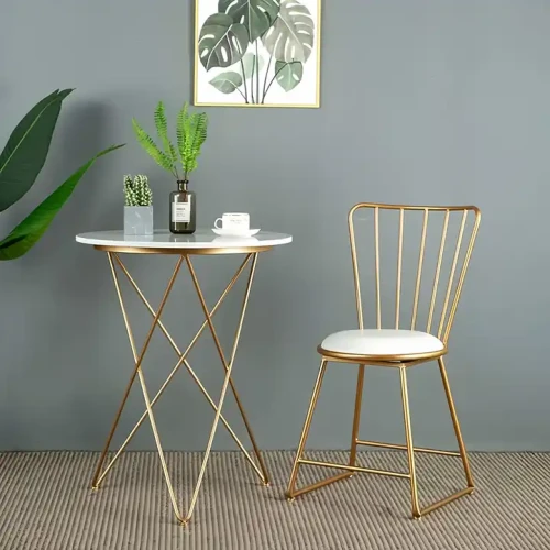 Luxury Design Home Furniture Dining Room Decoration Kitchen Modern Chairs with gold frame near a white round table and decorative plants.