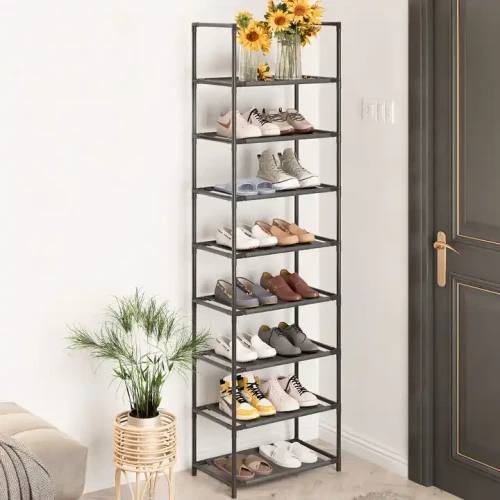 Shoe rack with multiple shelves holding various pairs of shoes in a modern living room.