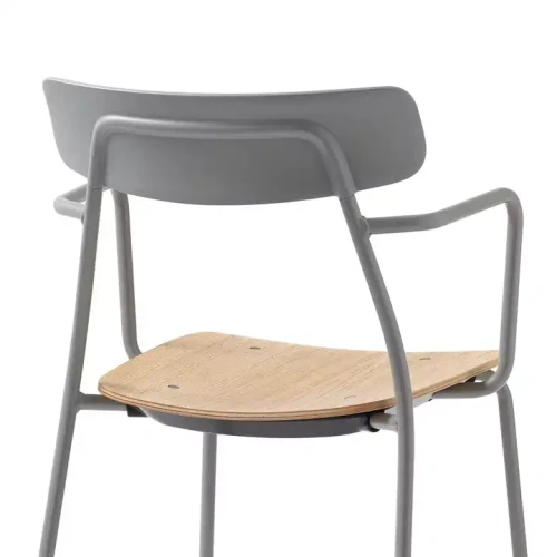 Modern indoor dining chair with metal frame.