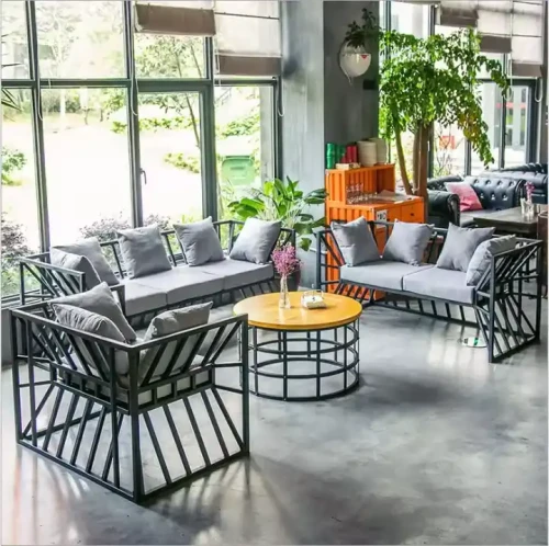 Modern Design Indoor Home Furniture 4 Pieces Metal Frame Sofa Set in a living room with large windows and plants