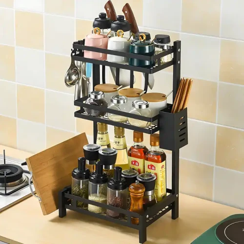 Compact 3-layer metal storage shelf for kitchen spices and tools.