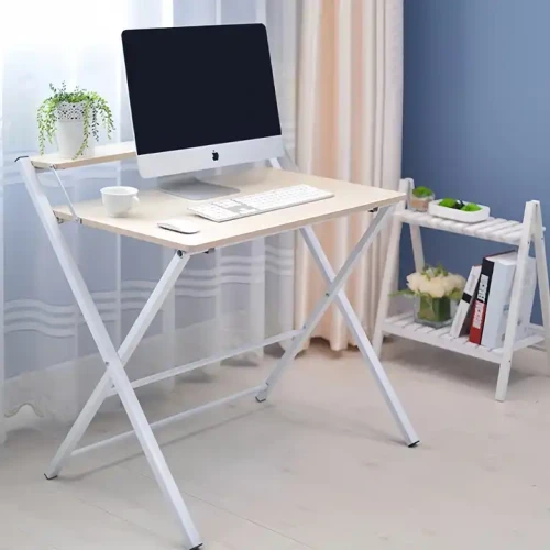 Modern foldable study table with computer and cup in home office setting