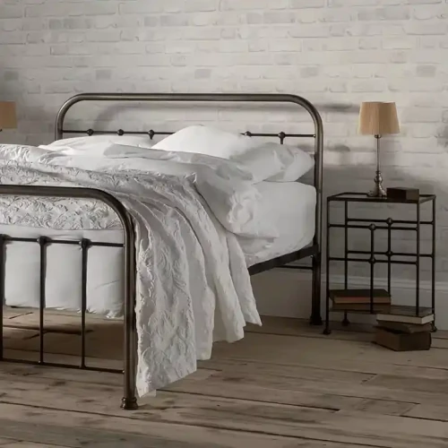 Modern luxury single metal bed for bedroom with white bedding.