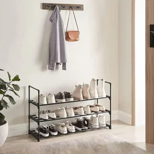 Modern Adjustable Design Indoor Home Furniture Metal Frame Shoes Rack with Extra Stackable Layer filled with various shoes in an apartment hallway.