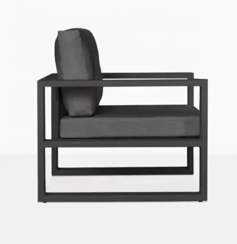 Folding Camping Chair with black frame and grey cushions, side view.