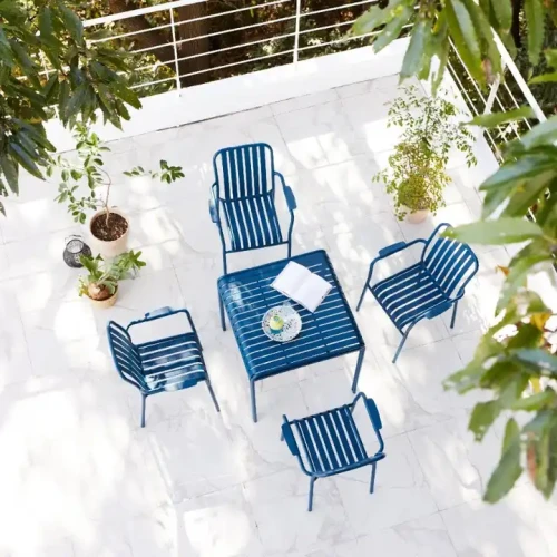 Custom Color Modern Garden Chair Outdoor Patio Furniture Set arranged on a terrace with plants.