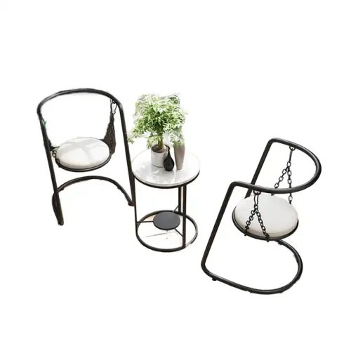 Luxury metal dining set for indoor and outdoor use with two chairs and a small table in a modern design.