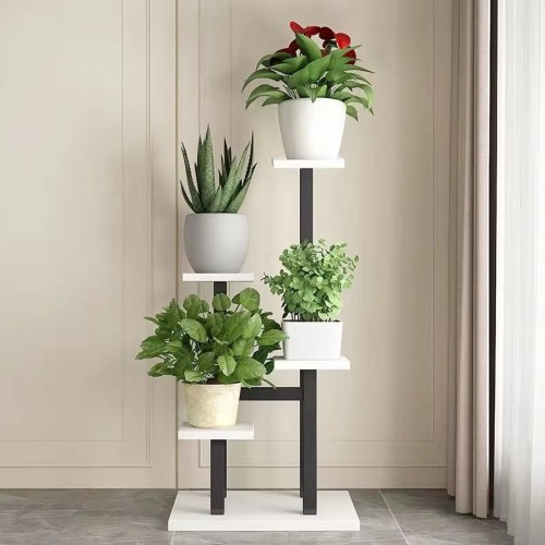 Potted plants on a white and black stand.