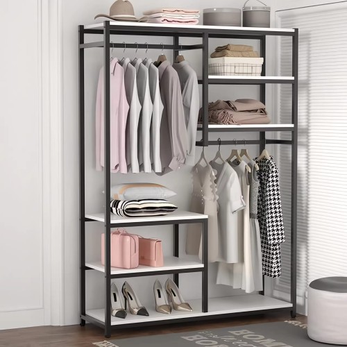 Modern bedroom wardrobe with womens clothes, metal frame, hanging and shelves.