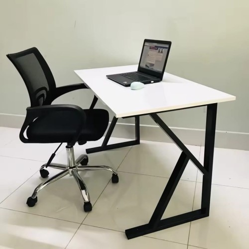 New design table frames for desk with laptop and chair in office setting.
