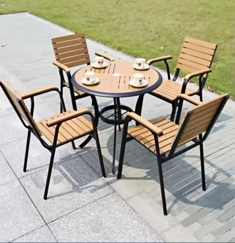 Factory Price dining table set garden courtyard simple outdoor for coffee shop and restaurant, featuring four chairs and a round table with coffee cups outside on a paved area.
