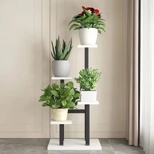 Potted plants on a white and black stand.