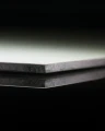 HPL PLATE WHITE thickness 10 mm (SAMPLE 50×50 MM) close-up on dark background