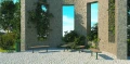 Outdoor setting with Nordhavn Outdoor Bar Table | 70 cm and modern stone structure in background.