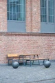 Amager Outdoor Table 150 cm 4-6 Seats with wooden benches outside a brick building