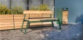 Nørrebro Outdoor Planter | 175 l next to a bench in a modern outdoor setting