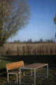 Frederiksberg Outdoor Table 180 cm 6-8 Seats with wooden bench in a park setting