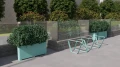 Kødbyen Bike Stand in a modern outdoor setting with greenery.