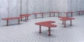 Red Sydhavn 3 Seater Public Backless Benches arranged in a tiled space.
